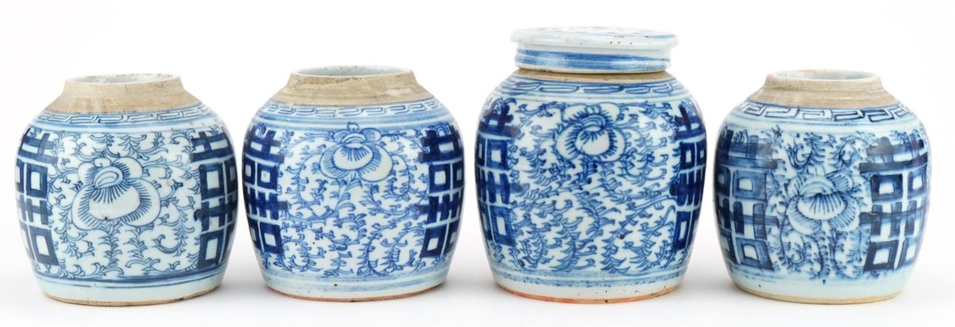 Four Chinese blue and white porcelain ginger jars, one with lid, each hand painted with flowers, the