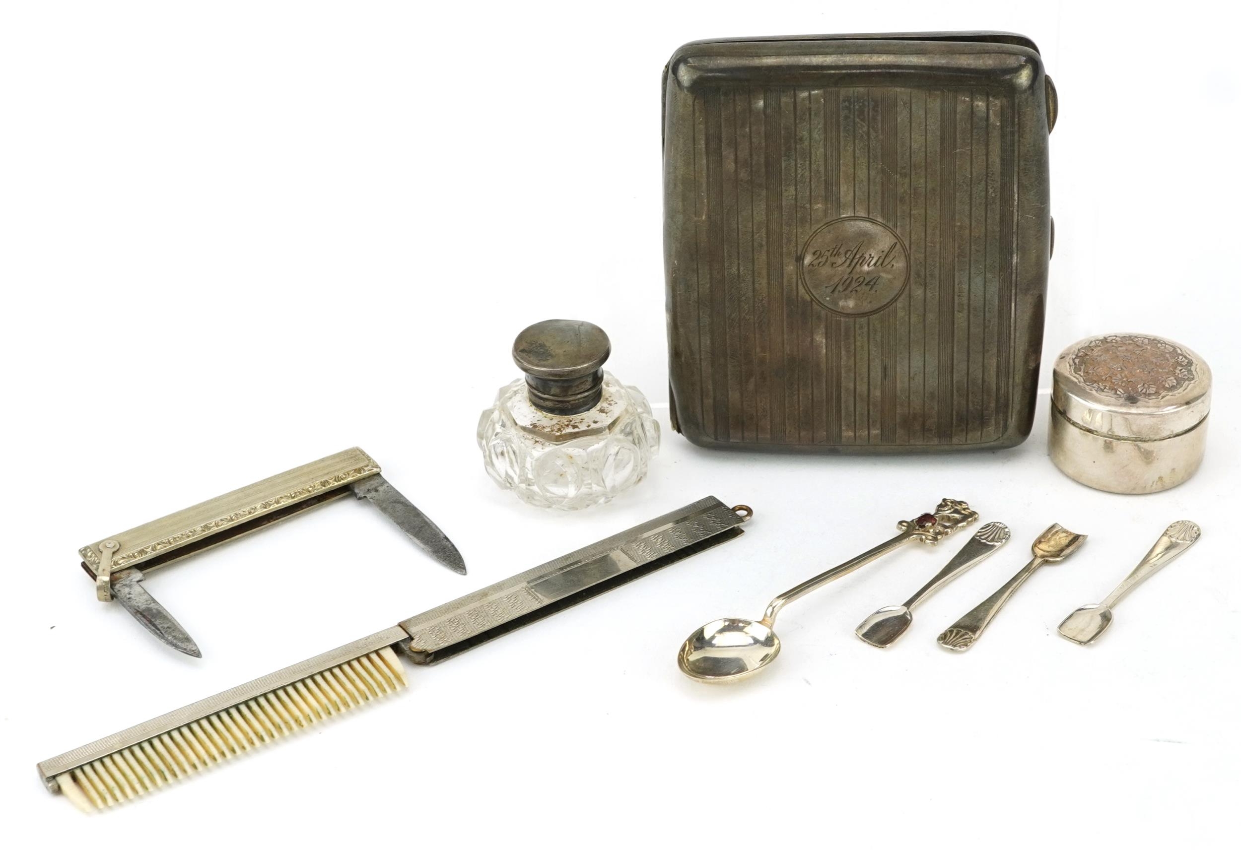 Silver objects including a rectangular cigarette case, circular pillbox and folding comb, the