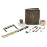 Silver objects including a rectangular cigarette case, circular pillbox and folding comb, the