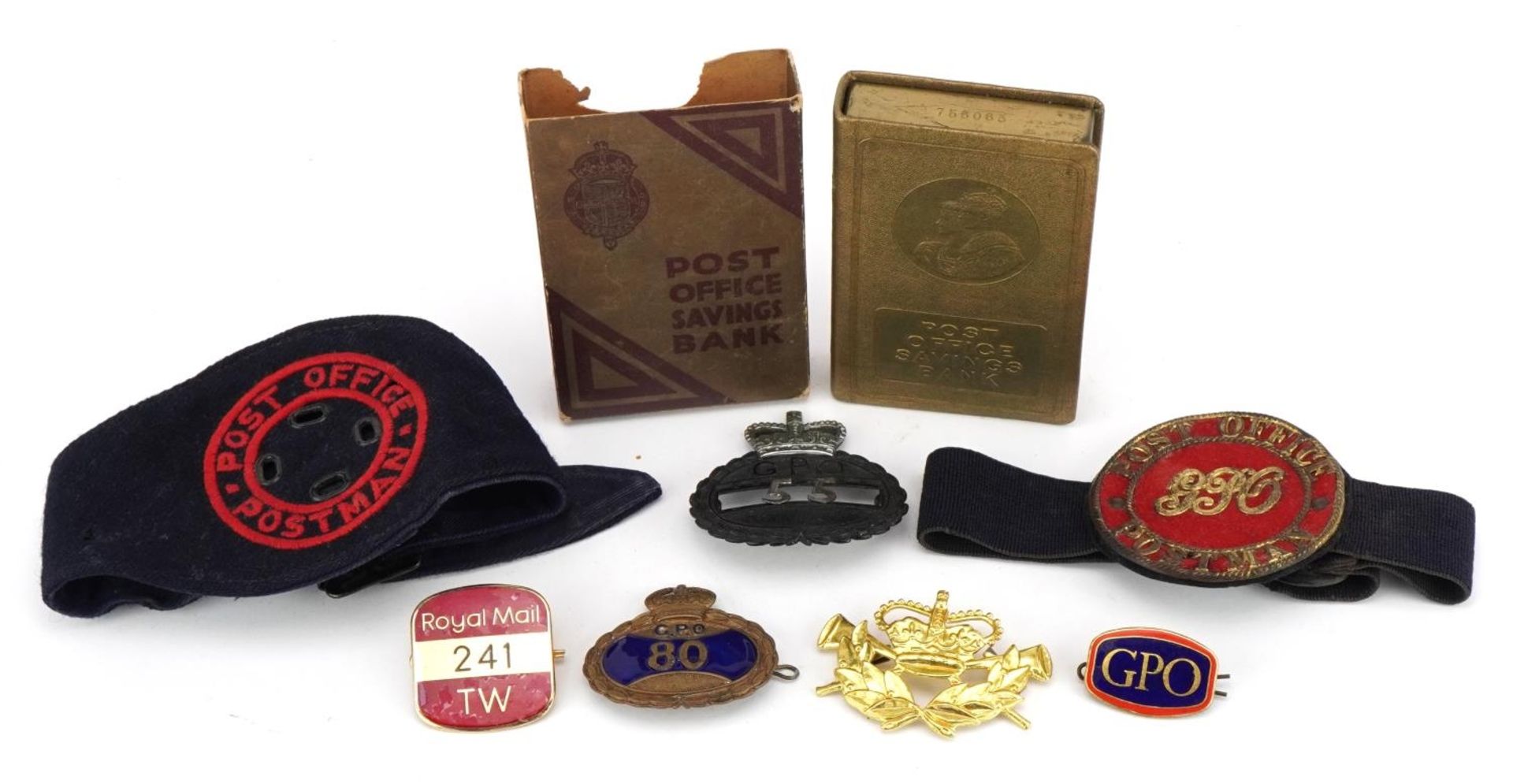 Post Office collectables including early postman armband, badges and Savings Bank