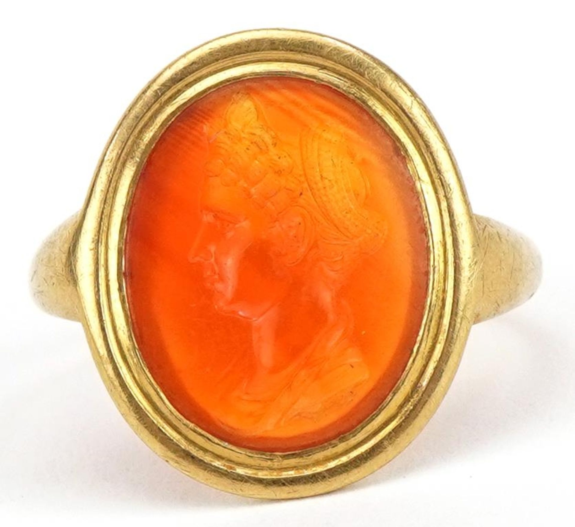 Antique unmarked high carat gold stone intaglio signet ring carved with a bust of a female, 3.7g