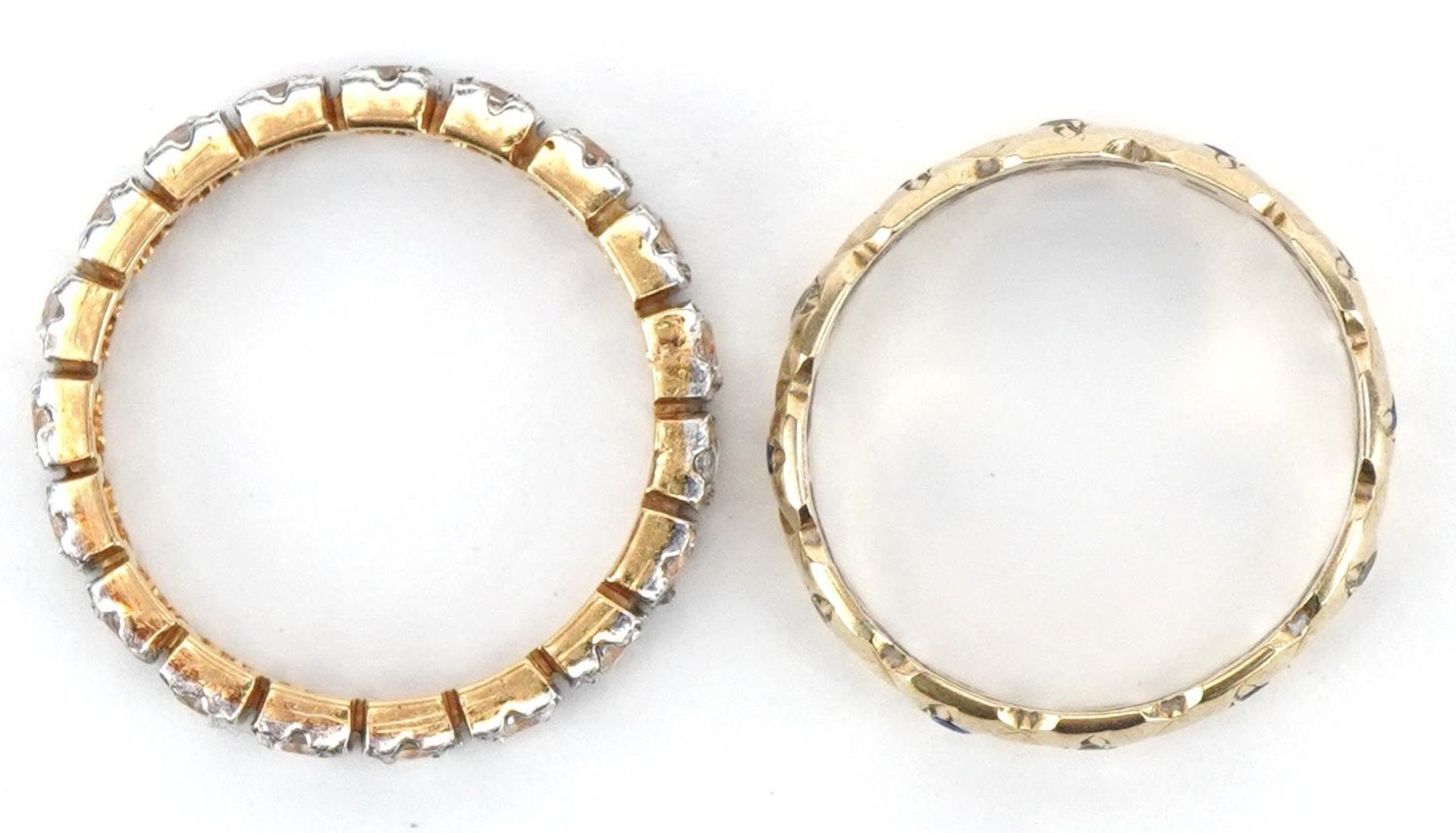 Two unmarked gold eternity rings set with clear and blue stones, test as 9ct gold, sizes N and L, - Bild 3 aus 4