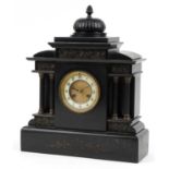 Victorian black slate mantle clock with reeded columns and circular chapter ring having Arabic