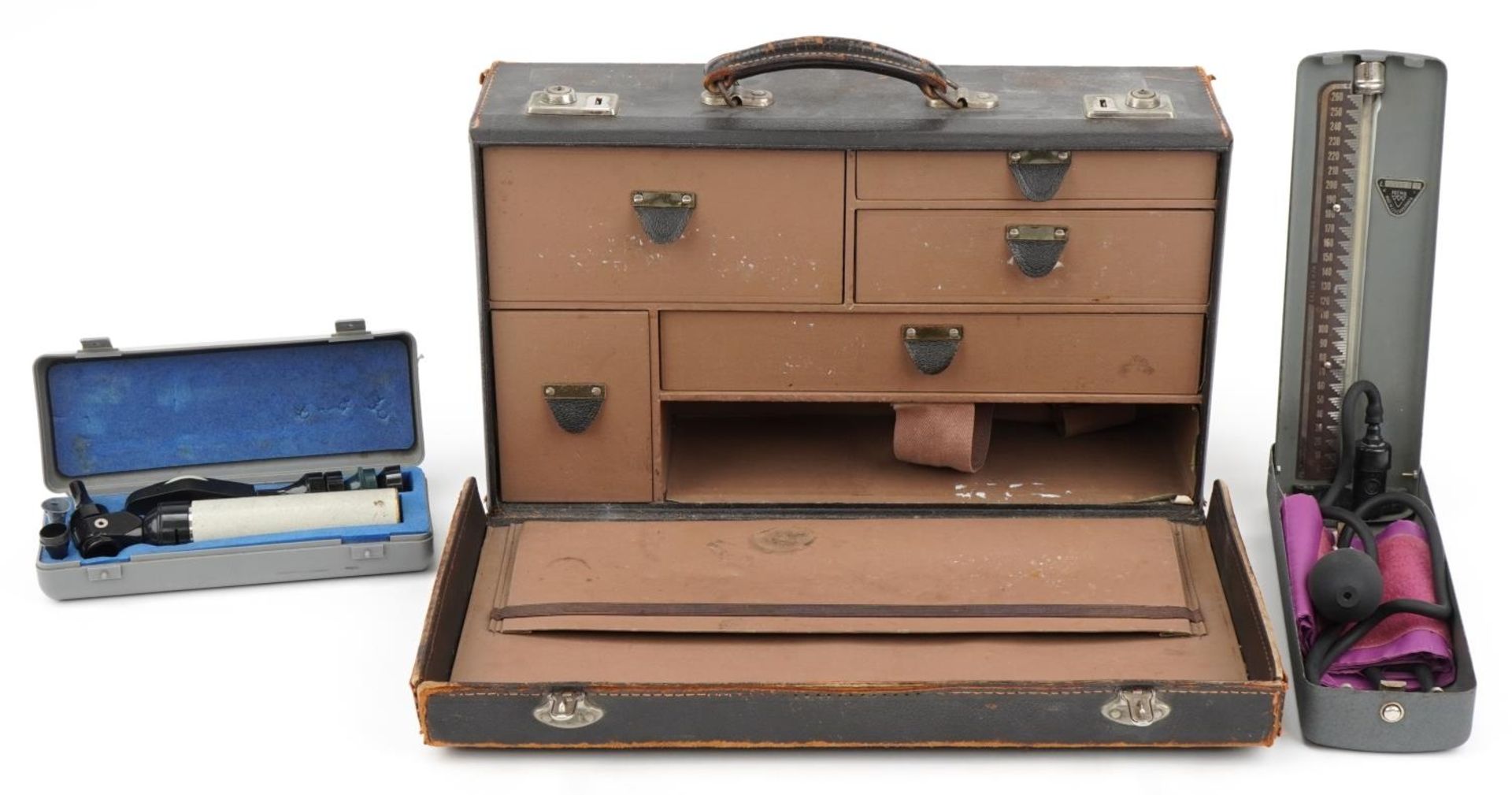 Vintage brown leather doctor's case with a Prema sphygmomanometer with case and an Keeler optical