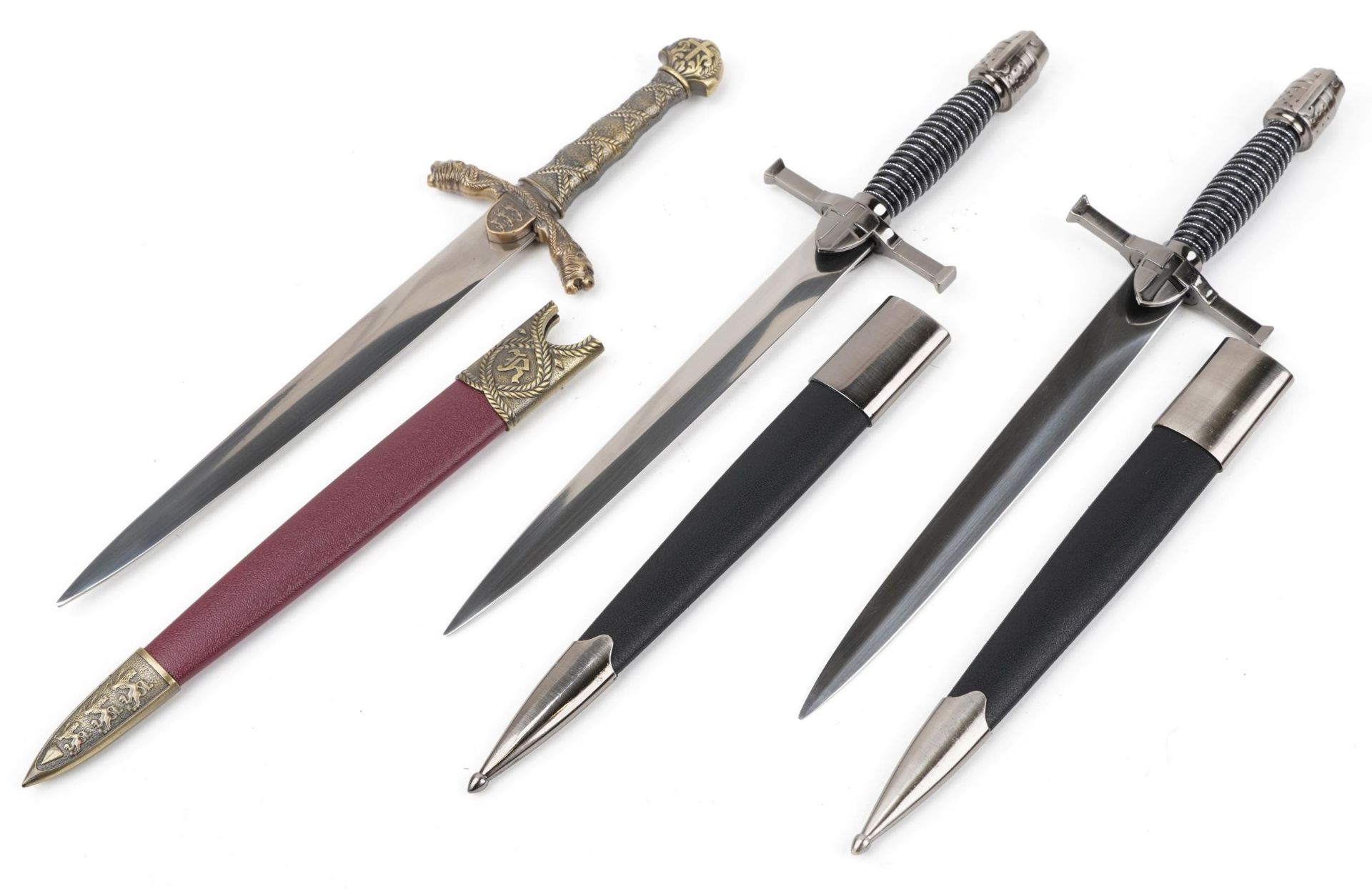 Three decorative swords with scabbards and boxes, each 40cm in length