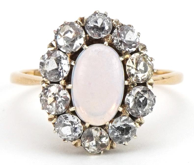 18ct gold cabochon opal and white sapphire cluster ring, the opal approximately 10.3mm x 6.6mm,