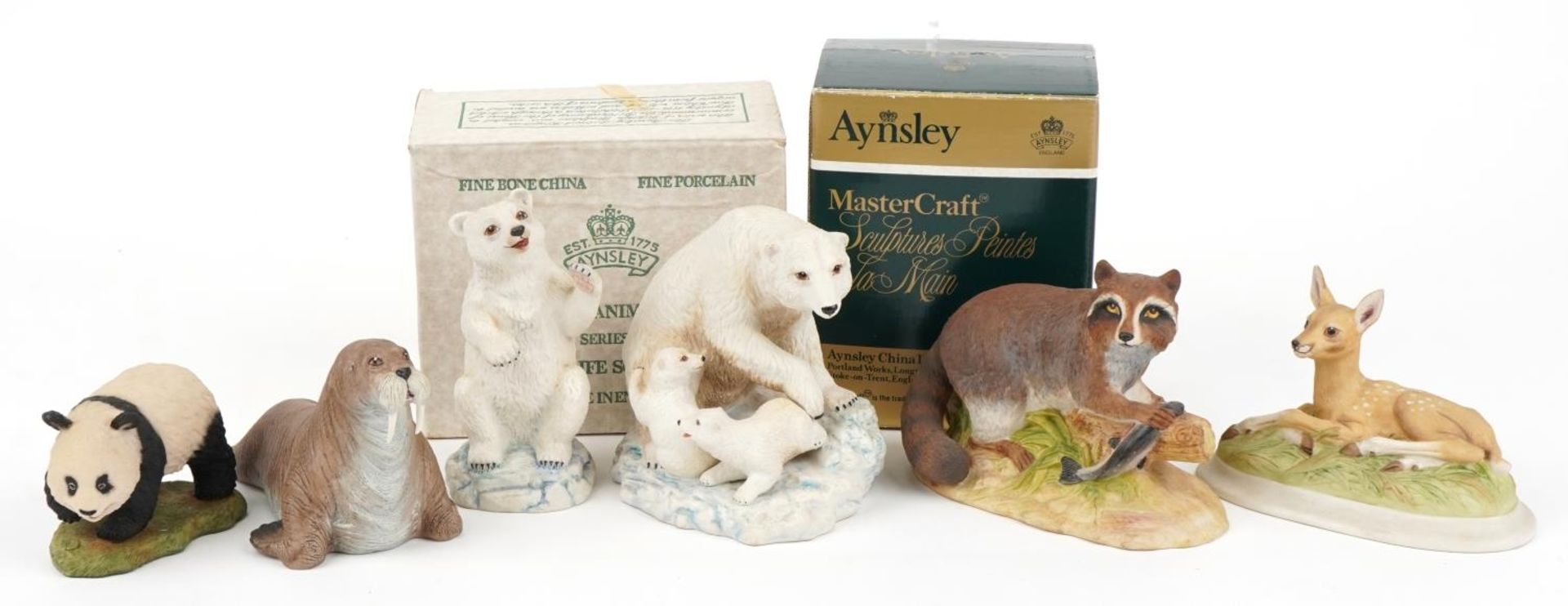 Six Aynsley porcelain animals including walrus, polar bear and racoon, the largest 18cm in length