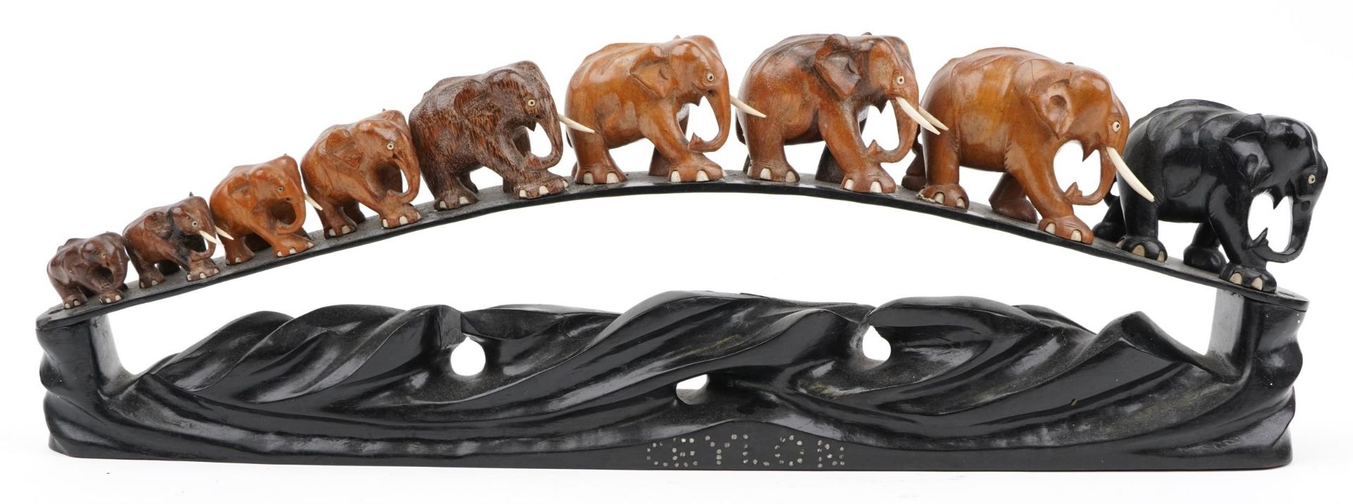 African ebony stand surmounted with nine graduated hardwood elephants, the stand inlaid Ceylon, 78cm - Image 3 of 8