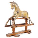 G & J Lines, Victorian gesso wood rocking horse with glass eyes, 91cm in length x 85cm high