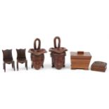 Woodenware including a rosewood casket and a pair of Indian figural cups, the largest 24cm high