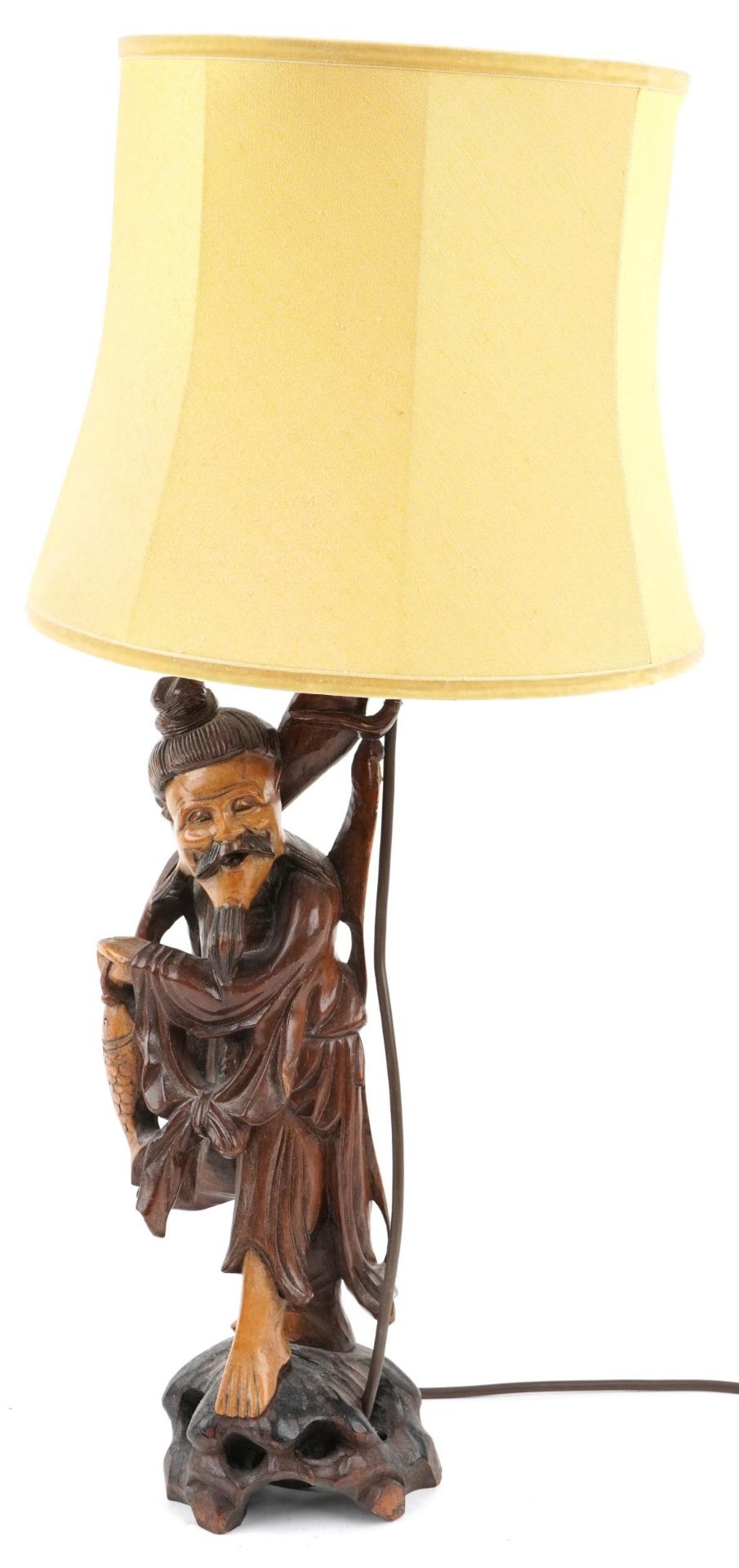 Chinese root wood table lamp with shade carved in the form of a fisherman, overall 68cm high