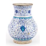 Turkish Ottoman Iznik pottery vase hand painted with stylised flowers, 20.5cm high