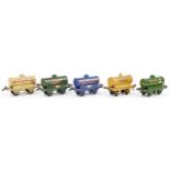 Five Hornby O gauge tinplate model railway advertising tankers comprising National Benzole