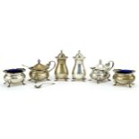 Adie Brothers, George V silver six piece cruet with blue glass liners, Birmingham 1928, the