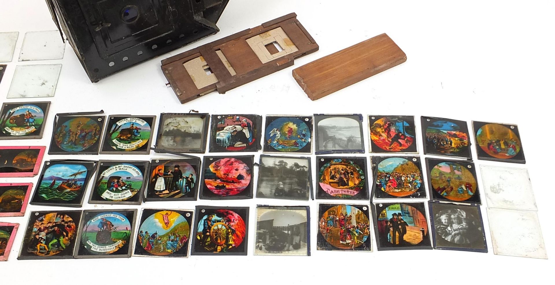 Vintage magic lantern with a collection of glass slides, some coloured, the lantern 40cm in length - Image 3 of 5