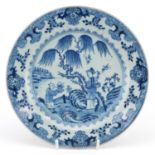 Chinese blue and white porcelain plate hand painted with figures in a landscape within a border of