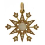 Edwardian 9ct gold mother of pearl and seed pearl starburst pendant housed in a tooled leather