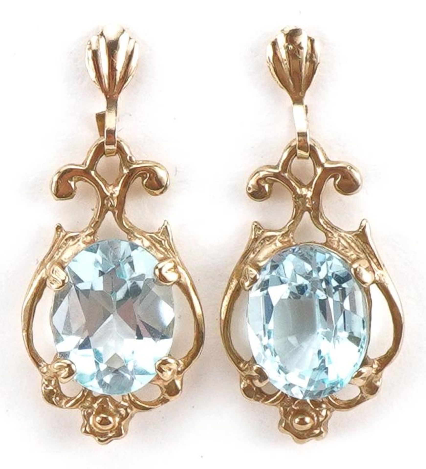 Pair of unmarked gold aquamarine drop earrings, the butterflies marked 375, 2.4cm high, 2.6g : For