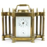 Brass cased carriage clock timepiece with columns and subsidiary dial having Roman and Arabic