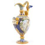 Attributed to Cantagalli, Italian Maiolica ewer with mythical handle and mask, hand painted with