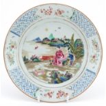 Chinese porcelain plate hand painted in the famille rose palette with an emperor and attendant in