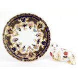 Royal Crown Derby seal paperweight and Royal Crown Derby cabinet plate decorated with flowers, the