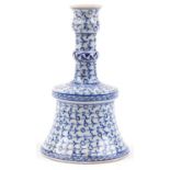 Turkish Iznik pottery candlestick hand painted with stylised floral motifs, 26.5cm high : For