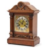 German oak bracket clock striking on a gong with Corinthian columns and silvered chapter ring having