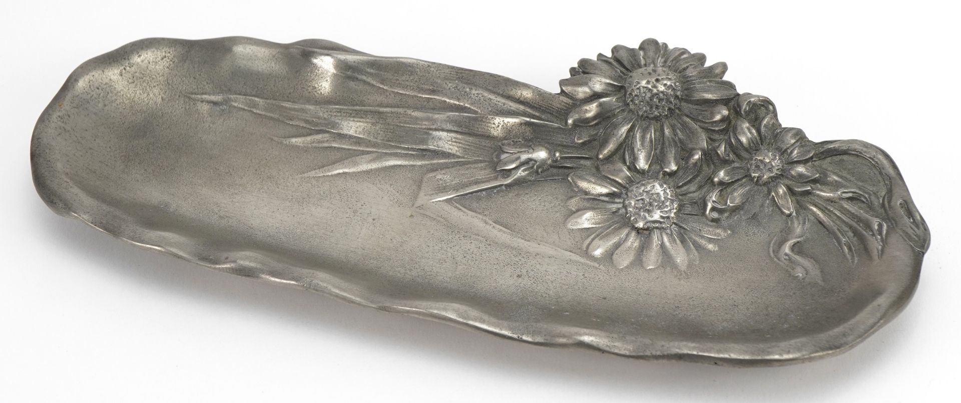 Manner of WMF, German Art Nouveau pewter pen tray decorated in relief with daisies, 22.5cm wide :