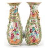 Pair of Chinese Canton porcelain vases, each decorated in relief with a dragon, each hand painted in