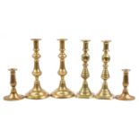 Three pairs of 19th century and later turned brass candlesticks, the largest each 30cm high : For