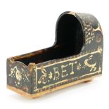 Slipware style cradle hand painted with a skeleton inscribed Bob Bet, 17.5cm in length : For further