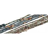 Two ancient Egyptian faience four strand bead necklaces, the largest 64cm in length : For further