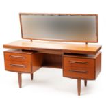 Mid century G Plan Fresco teak dressing table with mirrored back and four drawers, 120cm H x 152.5 W