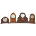 For inlaid mahogany mantle clocks, three with inlay and Roman numerals, the largest 24cm high :