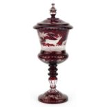 19th century Bohemian ruby overlaid glass goblet and cover etched with wild animals amongst foliage,