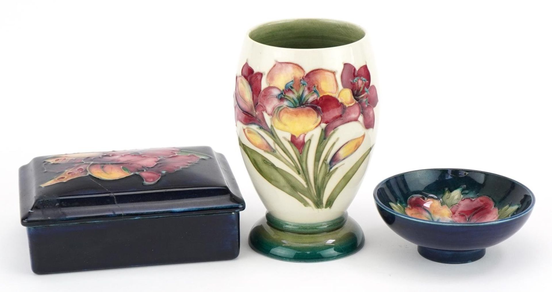 Moorcroft pottery hand painted with flowers including a William Moorcroft box and cover, vase and