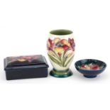 Moorcroft pottery hand painted with flowers including a William Moorcroft box and cover, vase and