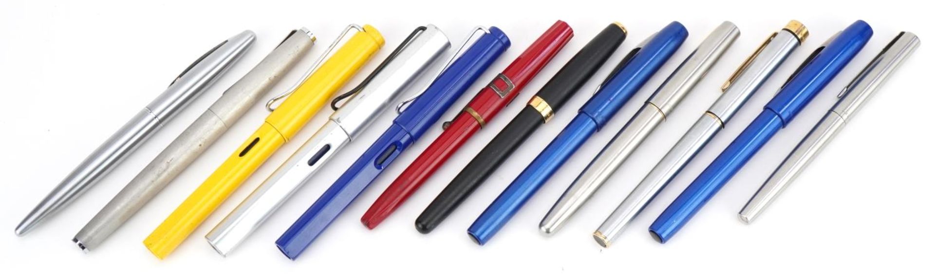 Twelve fountain pens including Sheaffer with 14k gold nib, five Parker and four Lamy : For further