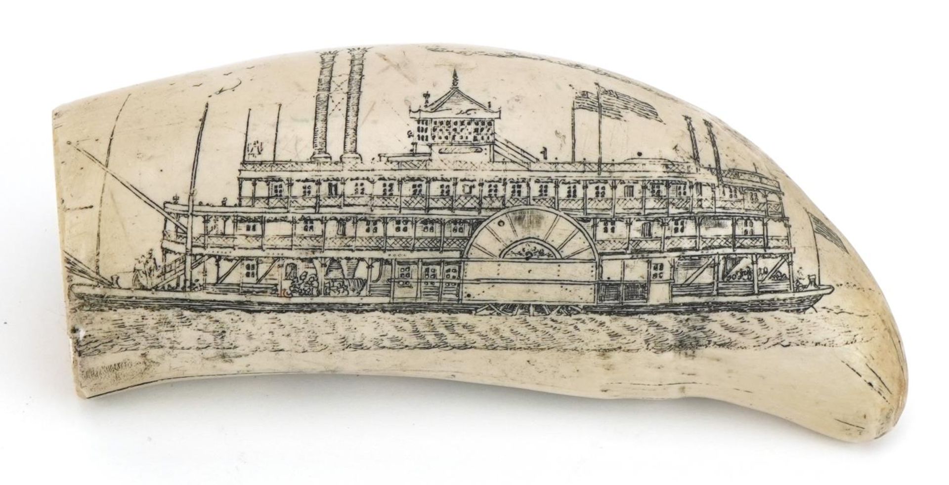 Reproduction scrimshaw tusk decorated with a ship and landscape, 15cm wide : For further information