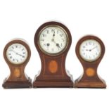 Three Edwardian inlaid mahogany balloon shaped mantle clocks, each with enamelled dial, two having