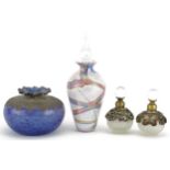 Art glassware including a mottled purple vase with silver overlay and an iridescent scent bottle