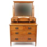 Arts & Crafts oak dressing chest with swing mirror and ornate bronzed handles, 147.5cm H x 91cm W