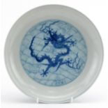 Chinese blue and white porcelain shallow dish finely hand painted with dragons amongst crashing