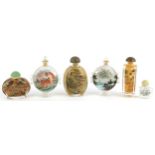 Six Chinese internally hand painted glass snuff bottles with stoppers including two with ring turned