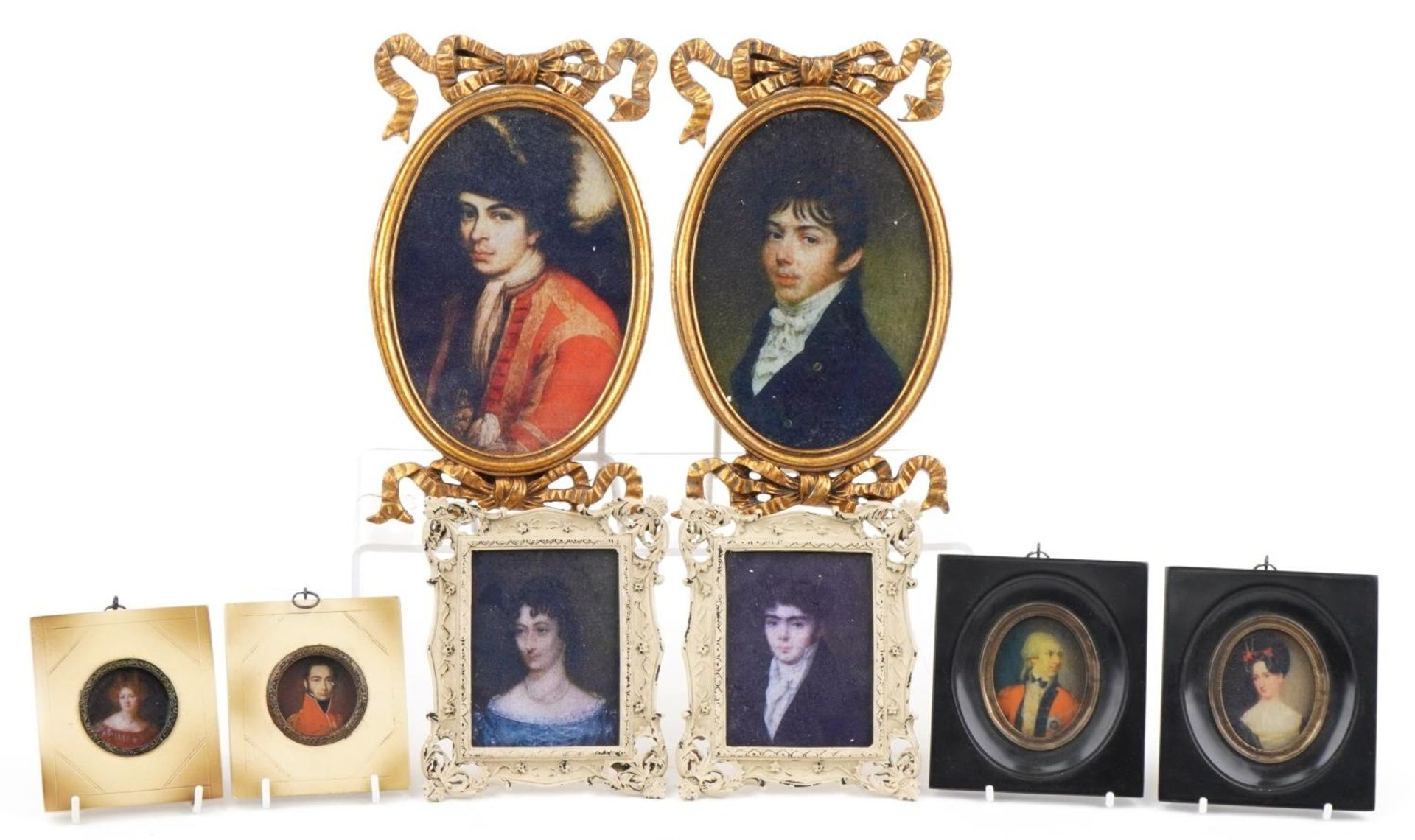 Four pairs of portrait miniatures including gentlemen wearing military dress, the largest overall