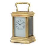 Miniature brass carriage clock with enamelled dial having Roman numerals, 9.5cm high : For further