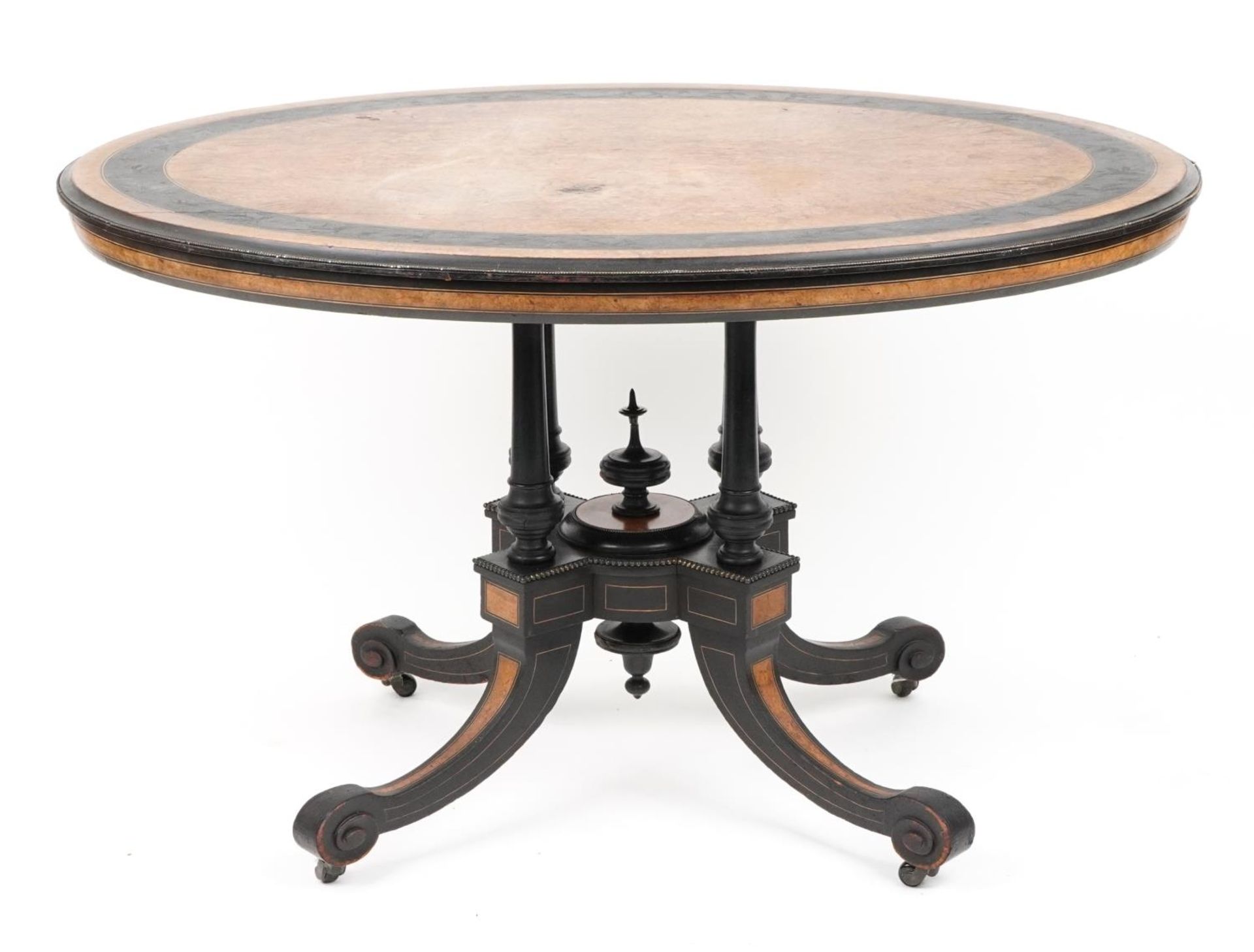 Victorian aesthetic burr walnut and ebonised tilt top table carved with flowers amongst scrolling