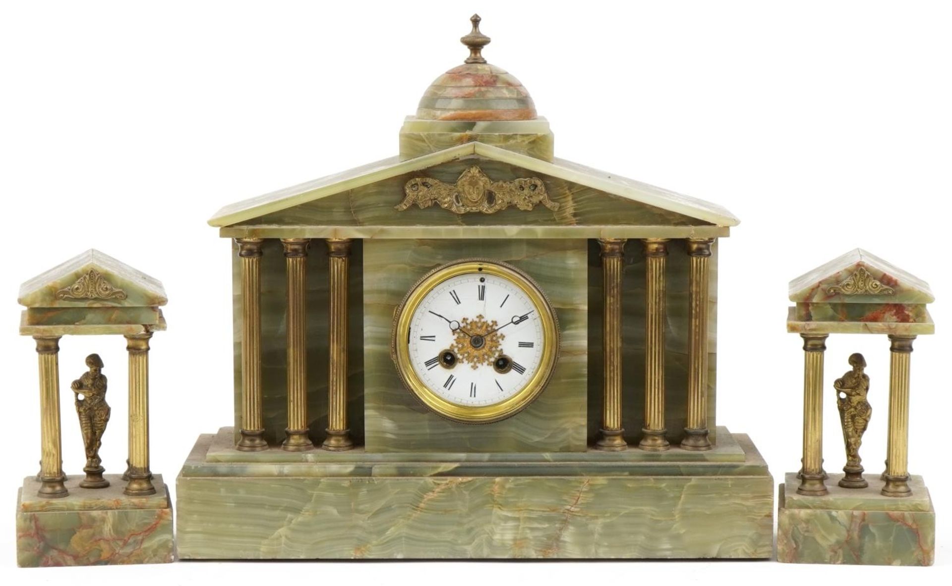 Early 20th century green onyx mantle clock striking on a bell having reeded columns and figural