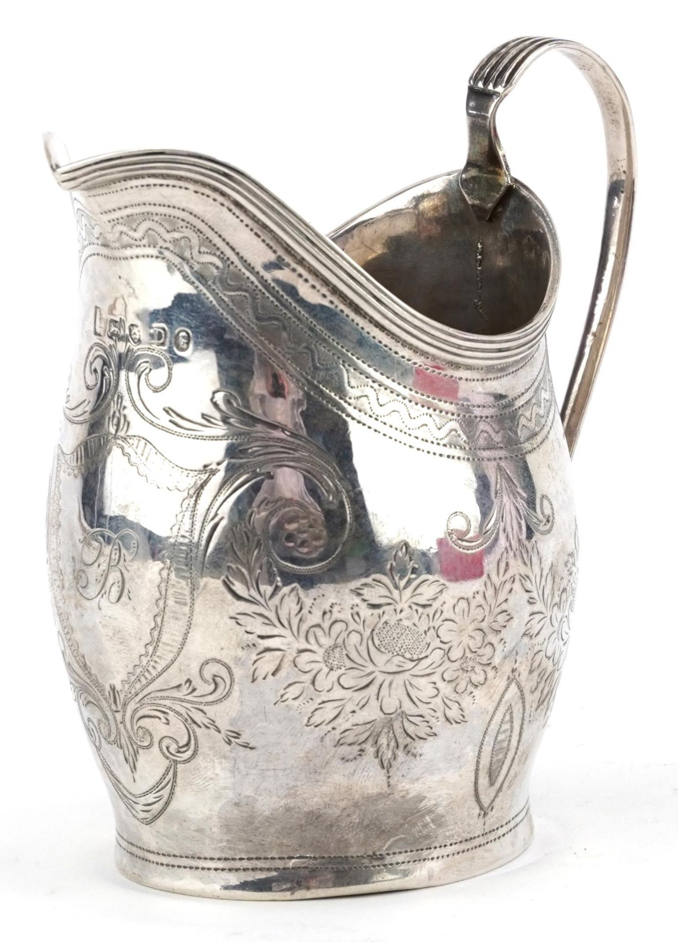 George III silver cream jug engraved with flowers and foliage, indistinct maker's mark, London 1799,
